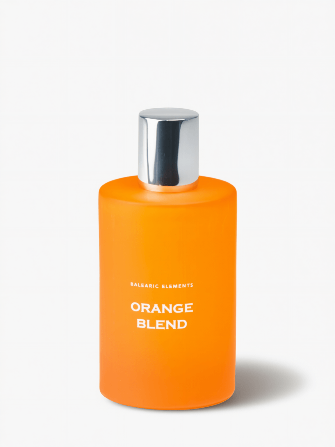 An orange bottle with a silver cap labeled 'ORANGE BLEND' by Balearic Elements, set against a plain white background.