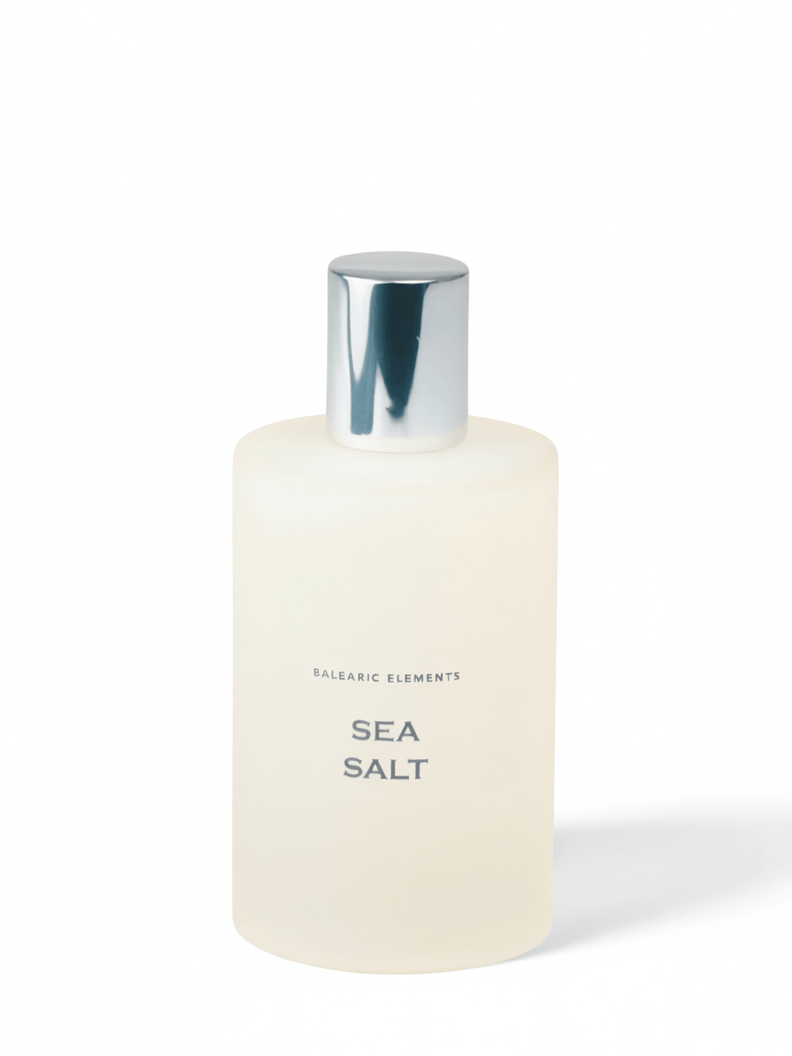 A frosted glass bottle of Balearic Elements Sea Salt bath product with a reflective silver cap, set against a clean white background.