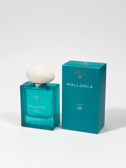 Mallorca For Her cologne bottle and packaging box. The bottle is a translucent teal glass with a white stone-like cap, and the box is a matching teal color with white branding.