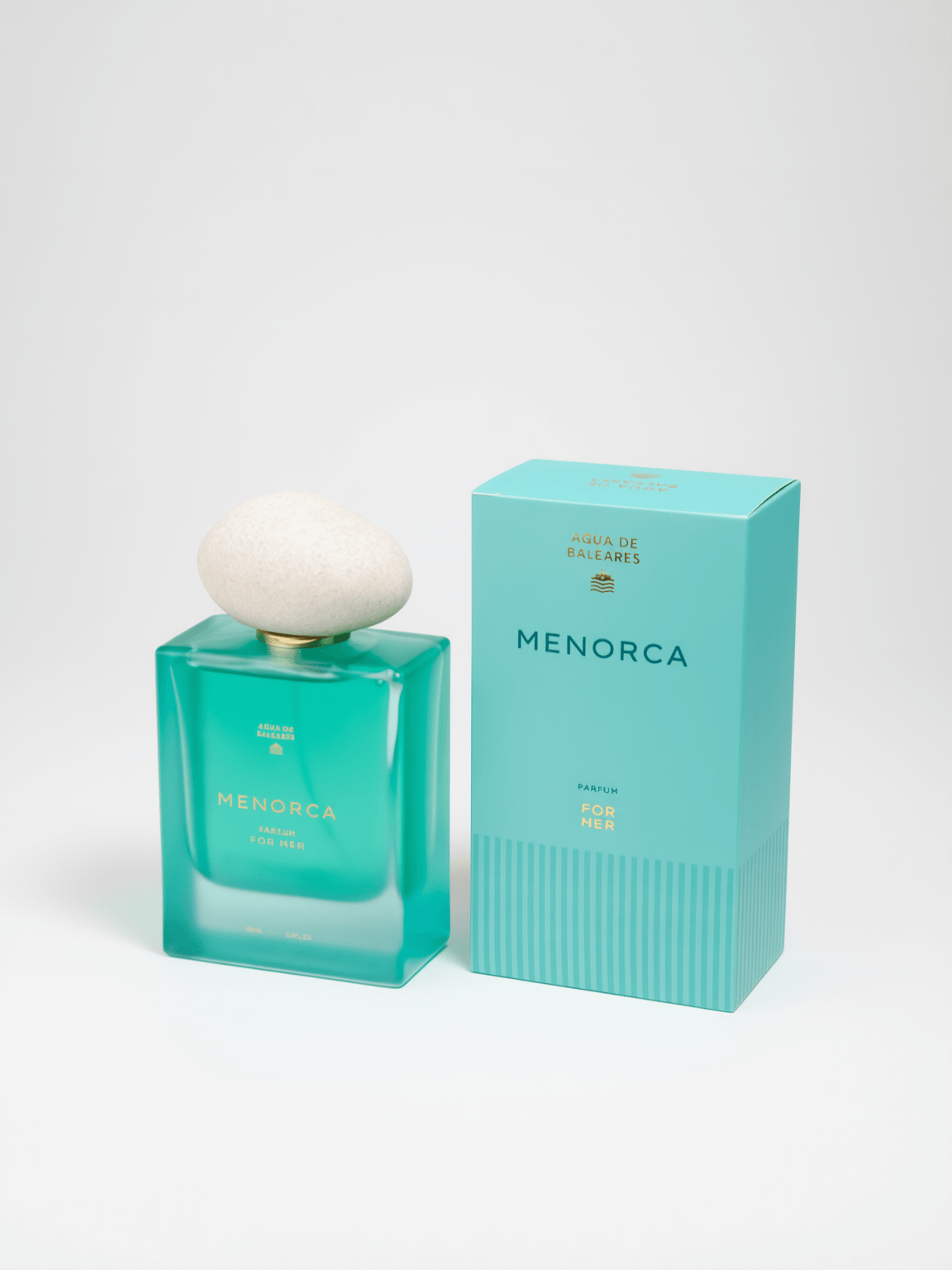 A turquoise glass perfume bottle with a white rounded cap stands beside its matching turquoise box on a clean white studio background. The bottle and box both show the brand name MENORCA.