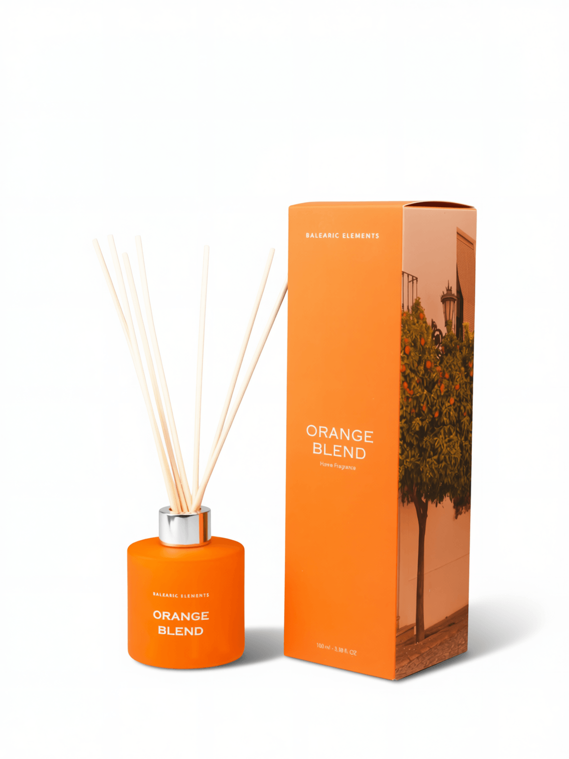 Orange reed diffuser bottle with natural reeds and a silver cap, shown next to its orange packaging box featuring an orange tree illustration. The text reads 'ORANGE BLEND' and 'BALEARIC ELEMENTS'.