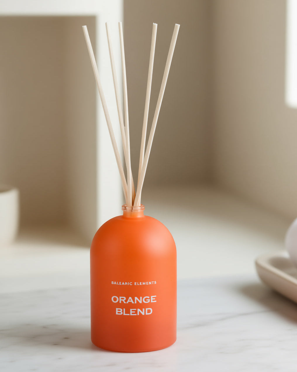 Orange Blend Reed Diffuser by Balearic Elements on a bathroom surface 