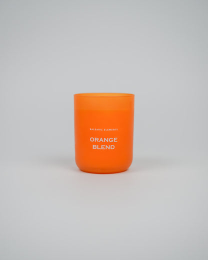 Orange scented candle labeled 'Orange Blend' on a white background
