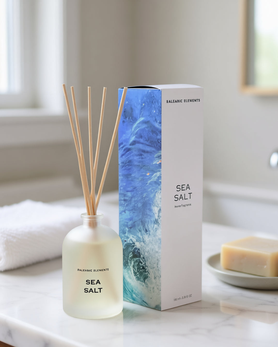 Sea Salt reed diffuser with packaging on a marble bathroom surface