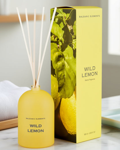 Yellow diffuser with 'Wild Lemon' packaging on a neutral background