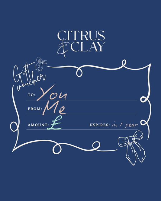 Gift voucher template with 'Citrus & Clay' branding on a blue background