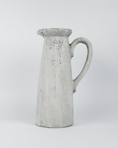 Grey ceramic pitcher on a white background