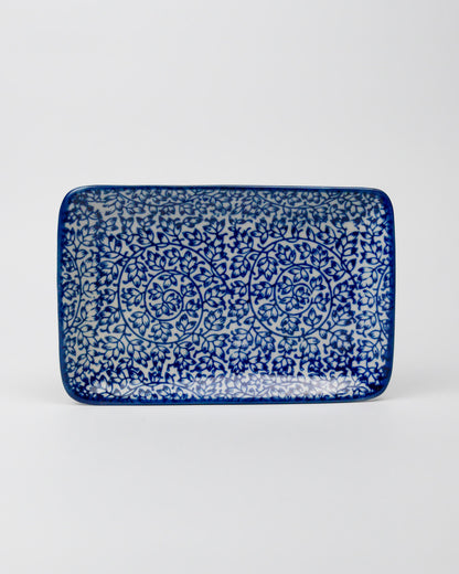 Rectangular ceramic tray with blue and white pattern on a white background