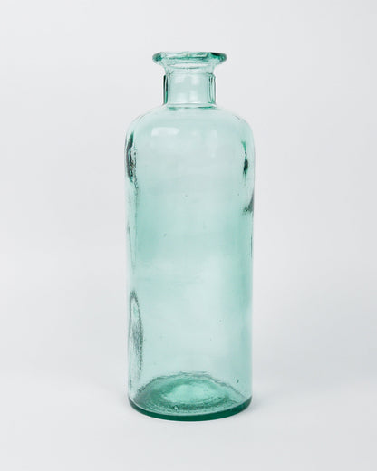 Green glass decorative bottle vase on a white background