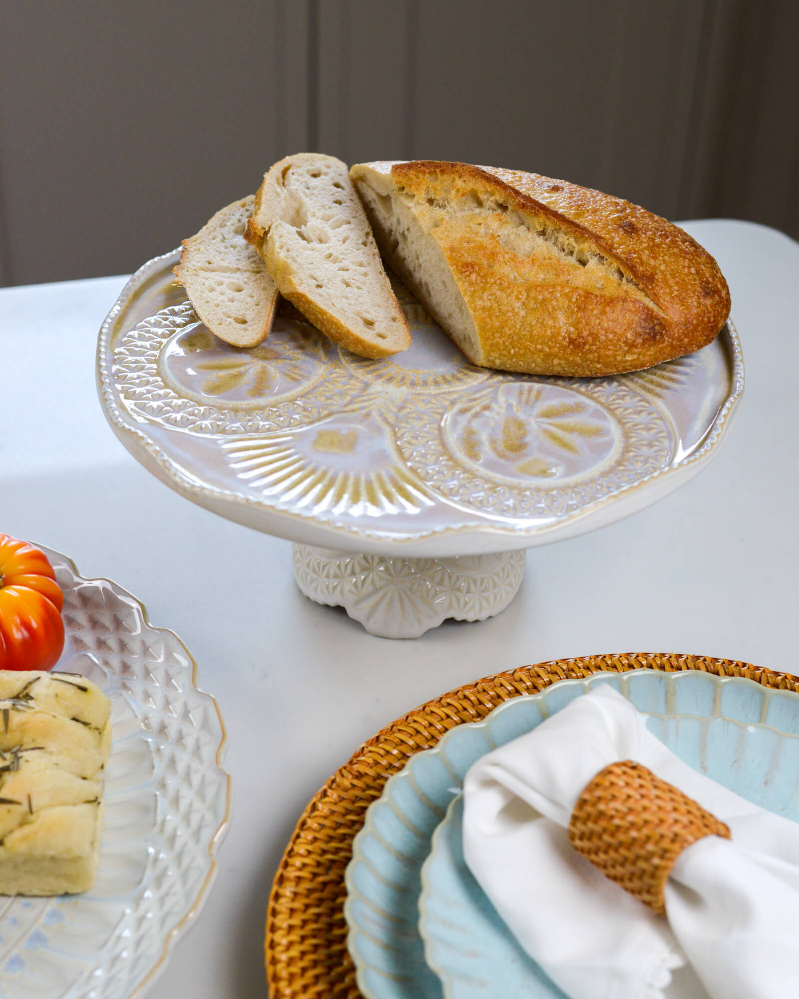 Loaf of bread on a decorative cake stand 