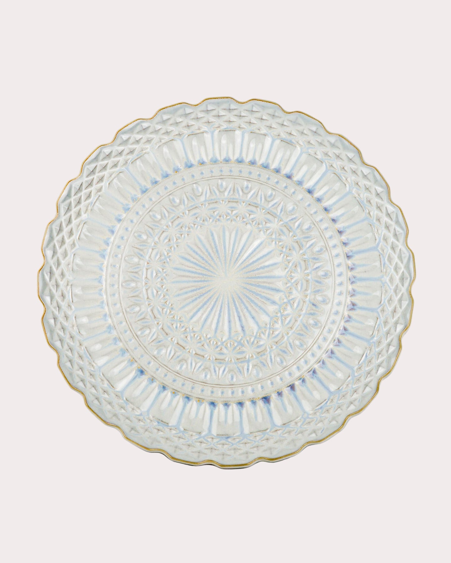 Decorative ceramic serving platter with intricate design on a white background