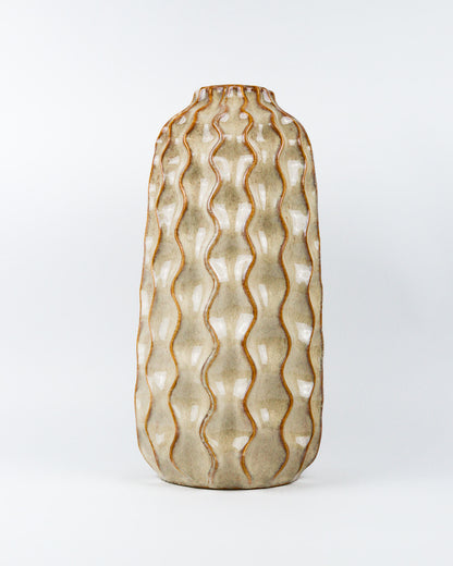 Decorative vase with wavy pattern on a white background