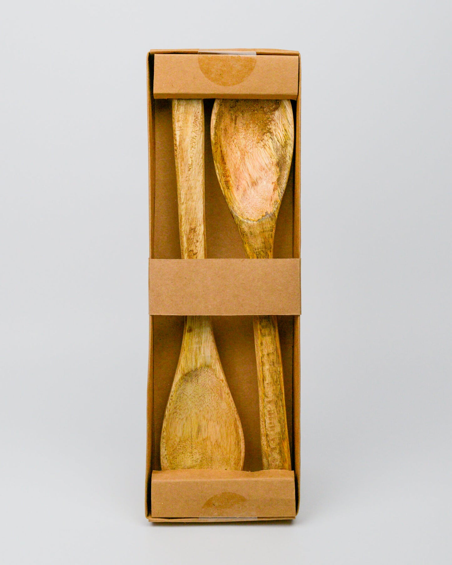 Mango wooden salad server set in a cardboard box on a white background