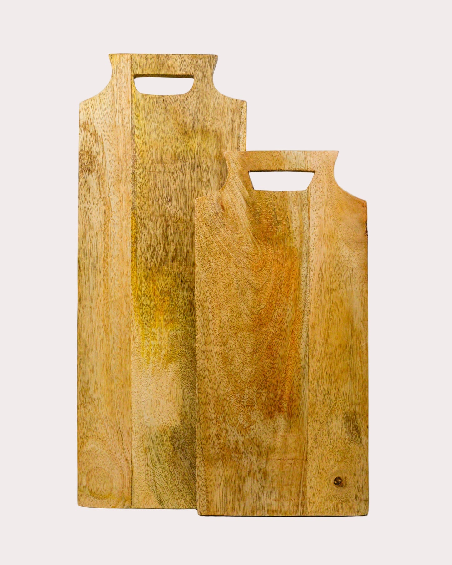 Two wooden cutting boards with handles on a white background