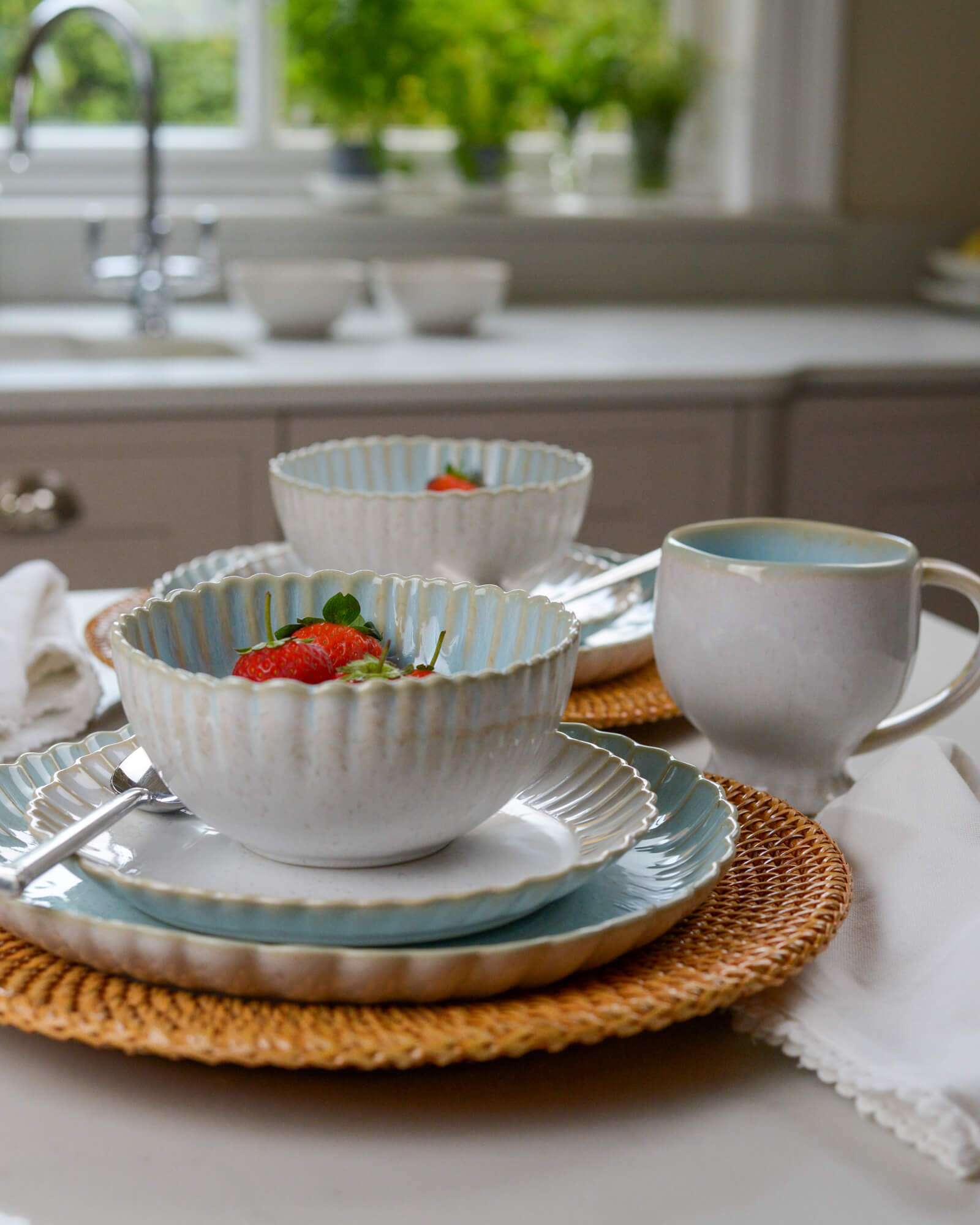 Scalloped edge cereal bowl on matching salad plate and dinner plate 