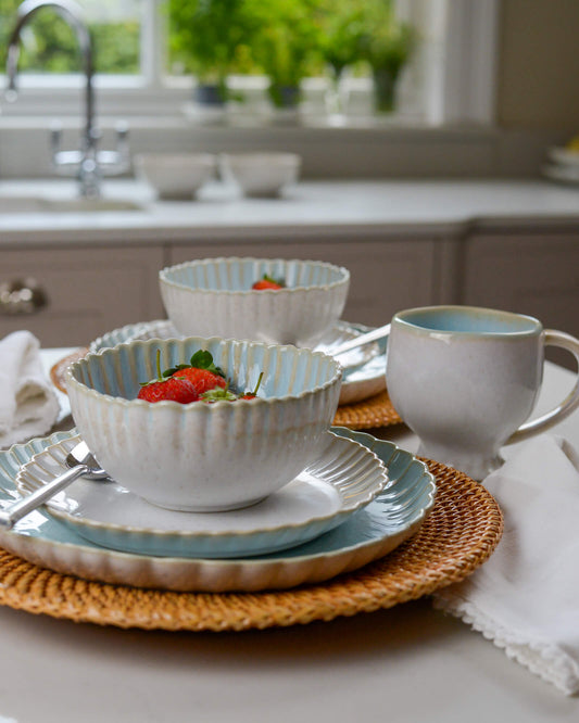 Scalloped edge cereal bowl on matching salad plate and dinner plate 