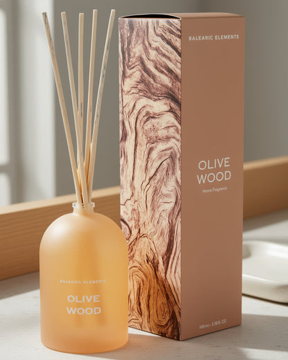 Olive Wood diffuser bottle and packaging on a neutral background