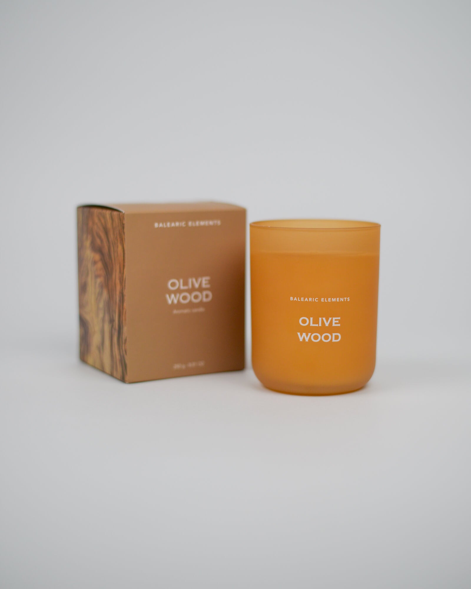 Olive Wood scented candle and packaging on a white background