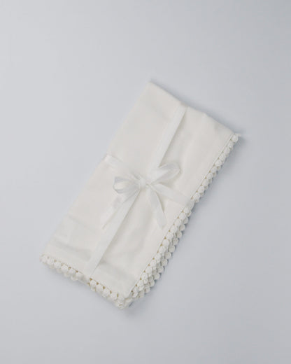 White cotton napkin with pearl edging
