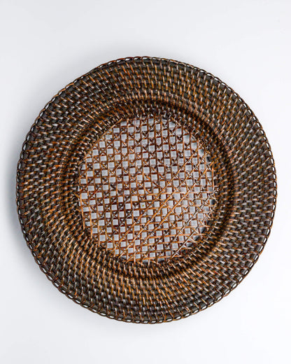 Woven rattan plate on a white background