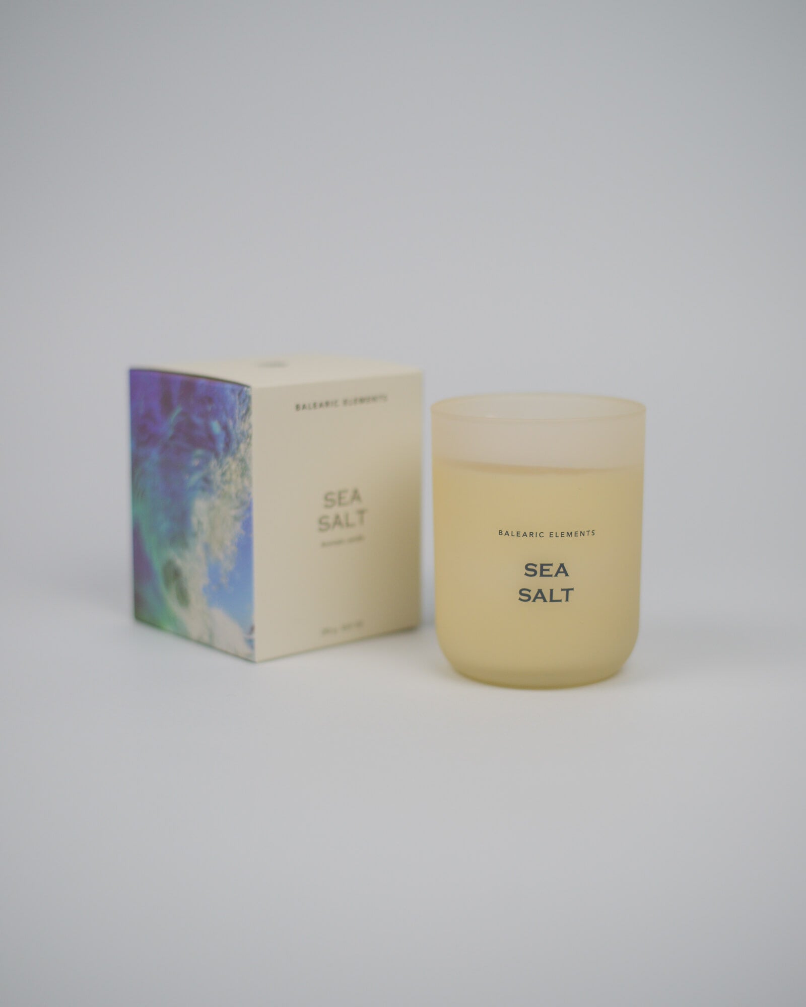 Sea Salt scented candle and packaging on a white background