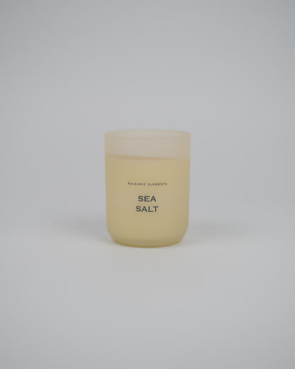 Scented candle labeled 'Sea Salt' on a white background