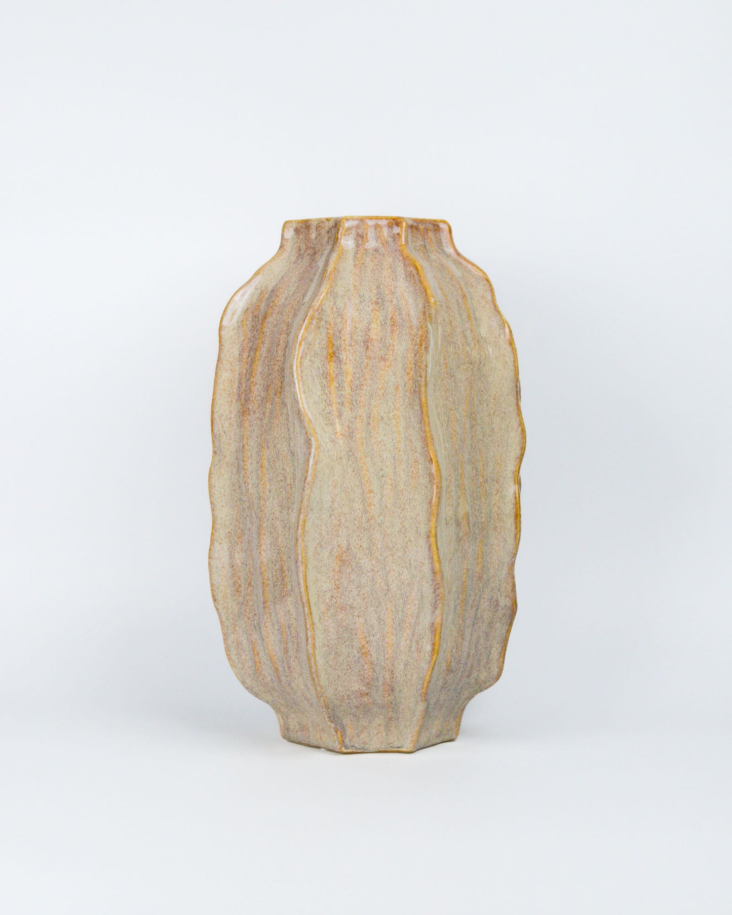 Decorative vase with a textured surface on a white background