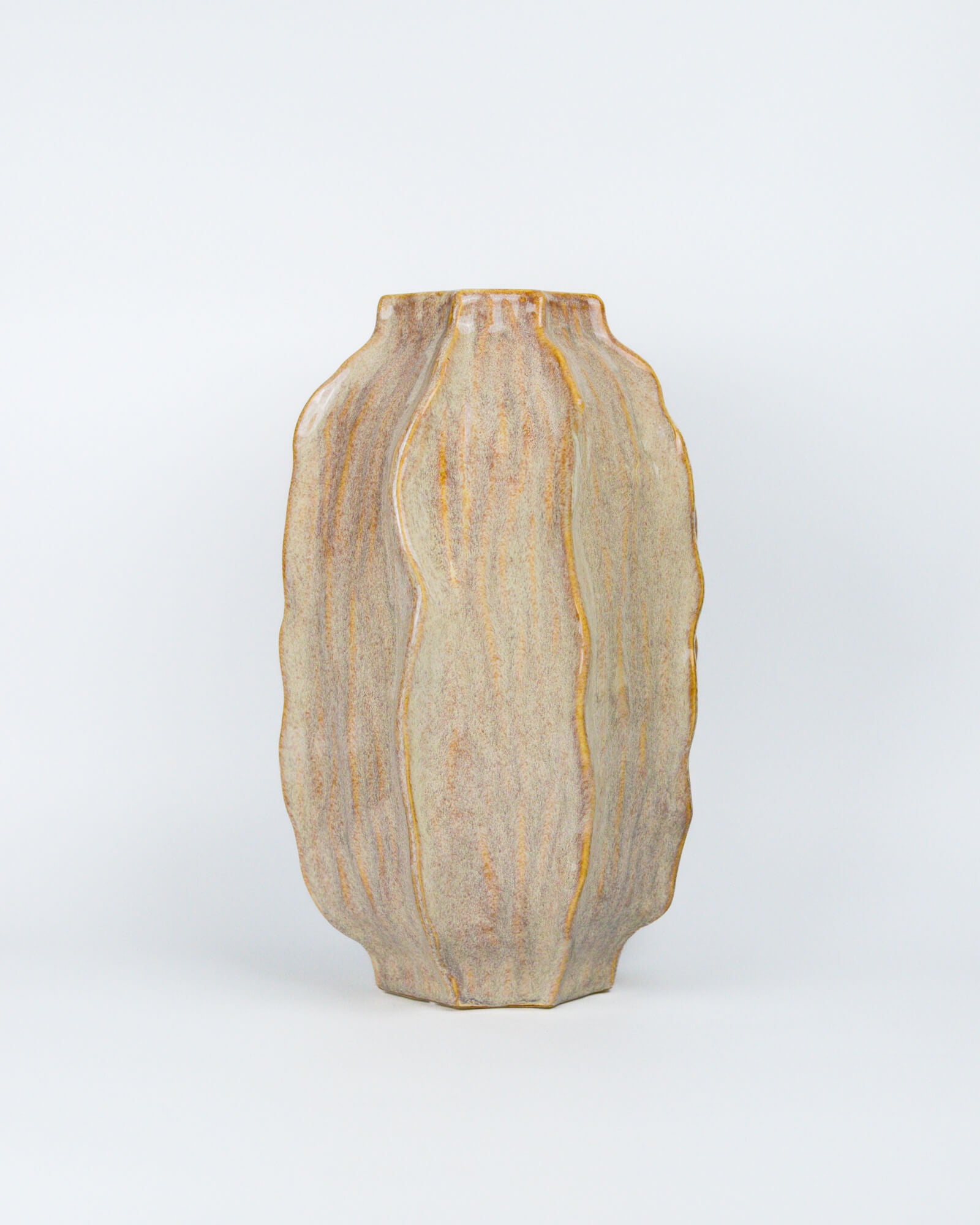 Decorative vase with a textured surface on a white background