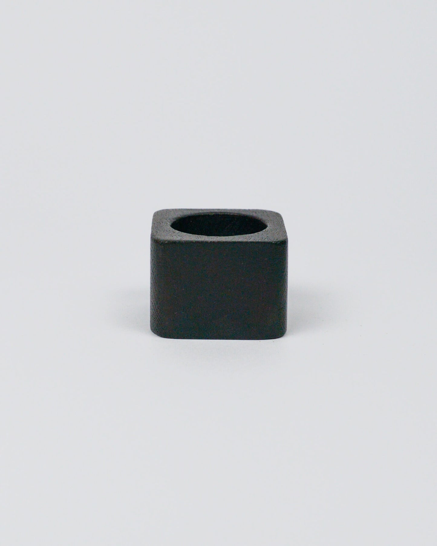 Dark wood square-shaped napkin ring on a white background