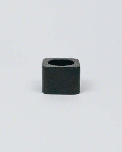 Dark wood square-shaped napkin ring on a white background