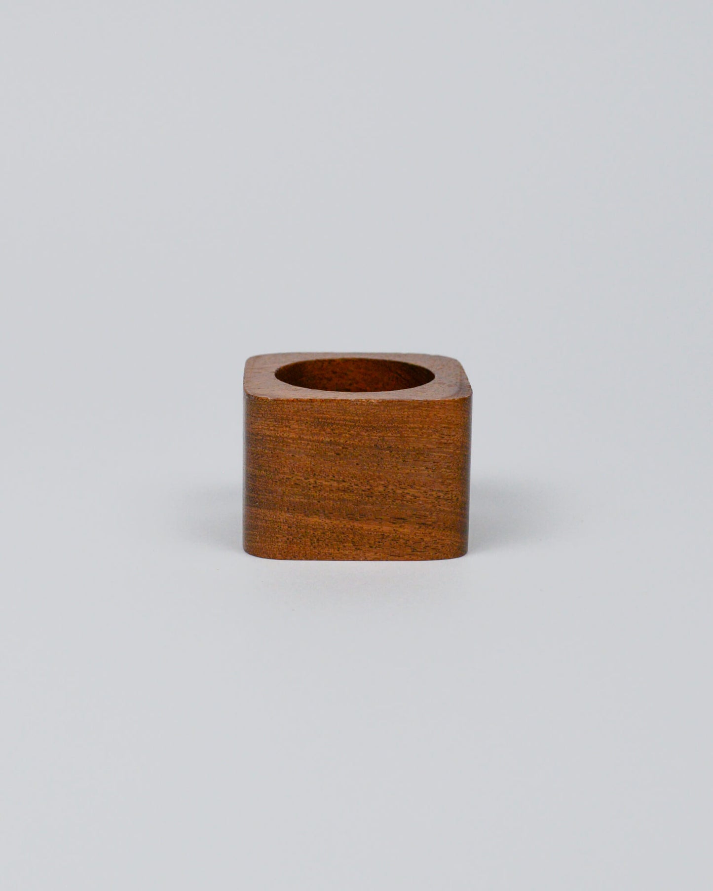 Light wooden squared napkin ring on a white background