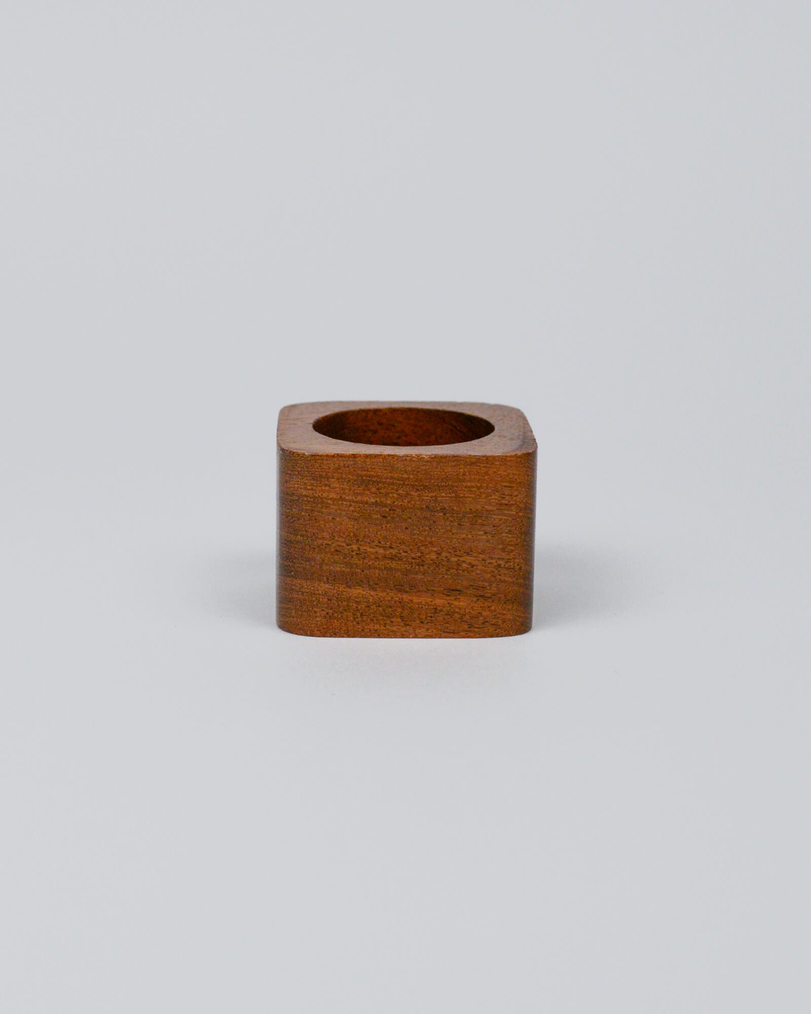 Light wooden squared napkin ring on a white background