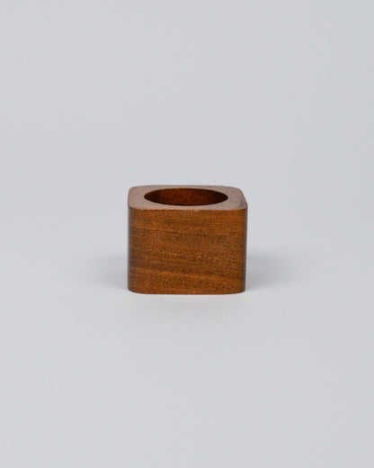 Light wooden squared napkin ring on a white background