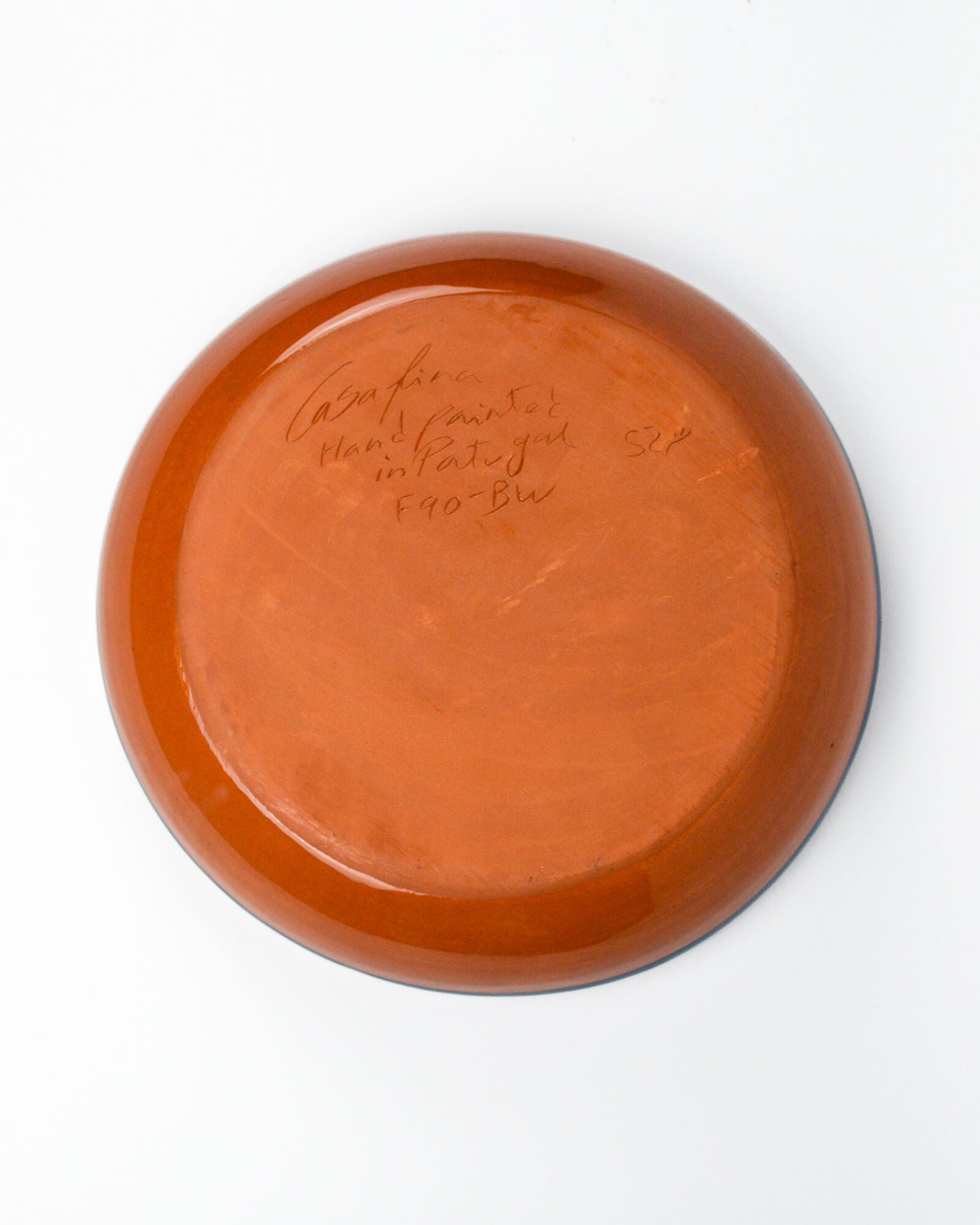 Terracotta serving bowl detail of base