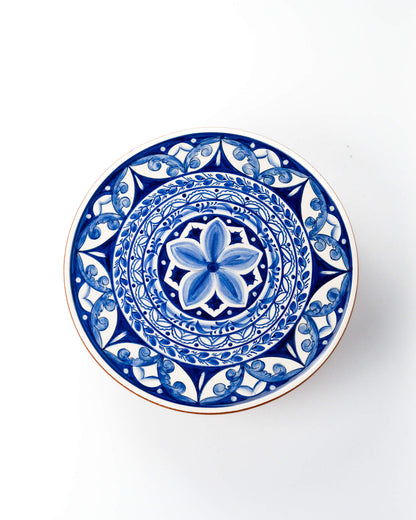 Decorative plate with blue floral design on a white background