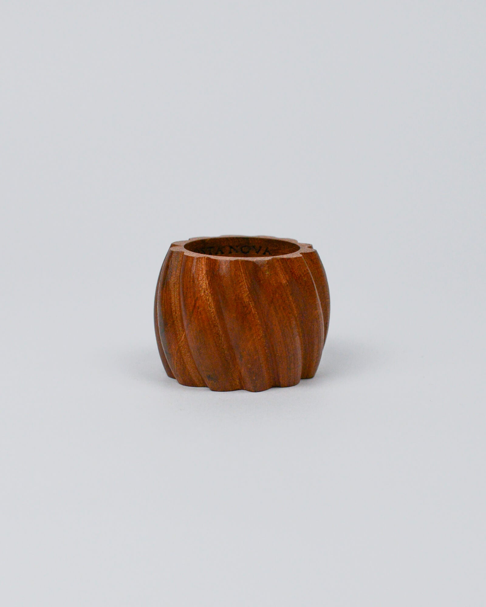 Wooden carved napkin ring on white background