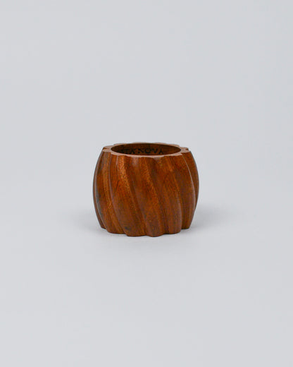 Wooden carved napkin ring on white background