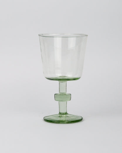 Clear recycled glass goblet wineglass on a white background
